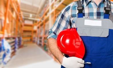 Worker man with helmet on background