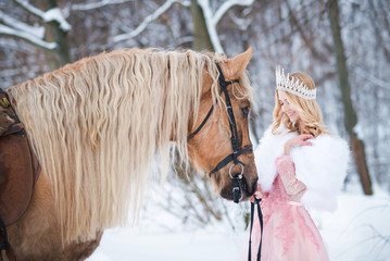 Princess in crown with horse in winter. Fairy tale © Elina Leonova