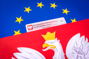 Polish id card on the background of the Polish and European flag