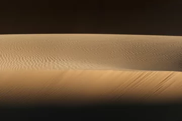 Fotobehang light and shadow make a beautiful abstract of this desert sand waves © Sebastian