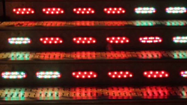 waltzer funfair ride at fairground flashing disco lights - stock footage 