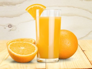 Orange juice and slices of orange on background © BillionPhotos.com
