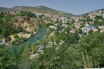 Fototapeta na wymiar Tunceli city views, a city in Turkey, tunceli city scape, munzur river with tunceli city scape, 