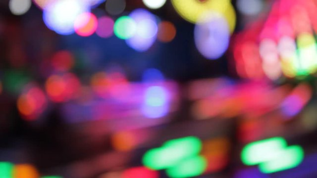 disco lights funfair fairground ride rainbow bokeh lights rides moving flashing people at night