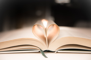 Book pages folded into heart