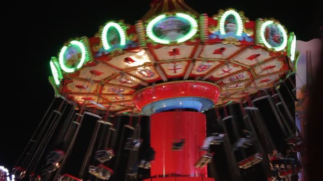 swing ride funfair fairground ride carousel merry go round  copy space night fun entertainment rotate spinning turn stock, footage, video, clip,