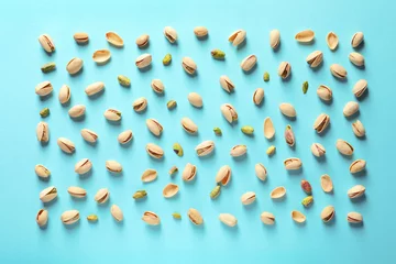 Foto op Canvas Composition with organic pistachio nuts on color background, flat lay © New Africa
