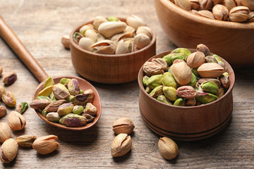 Composition with organic pistachio nuts on wooden table