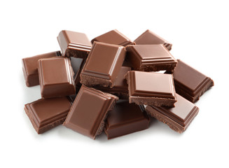 Pieces of tasty milk chocolate on white background