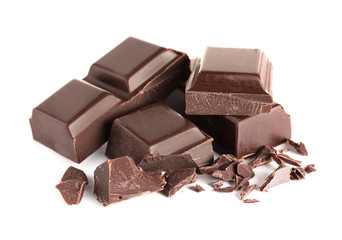 Pieces of tasty dark chocolate on white background