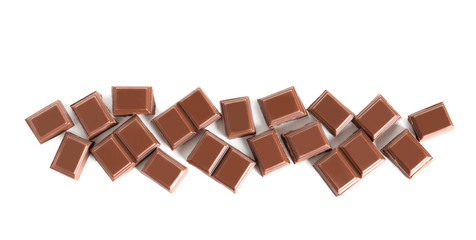 Pieces of tasty milk chocolate on white background, top view