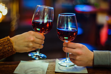 wine glasses in hand