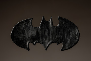 Figure of a black bat made of clay by a child