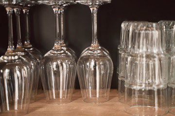 glasses and plates on the shelves of  a stylish modern restaurant. 