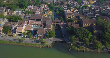 Fototapeta na wymiar Aerial view of Chua Cau (the Pagoda Bridge) or The Japanese Covered Bridge in Hoi An old town or Hoian ancient town. The Pagoda Bridge is one of the famous tourist and travel in Hoi An, Vietnam