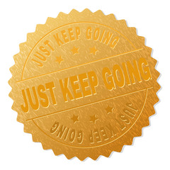 JUST KEEP GOING gold stamp award. Vector golden award with JUST KEEP GOING text. Text labels are placed between parallel lines and on circle. Golden skin has metallic texture.