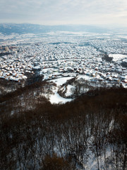 Aerial of rooftops covered with snow
