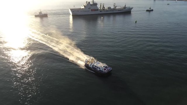 Aerial video of a hovercraft coming to shore at Portsmouth