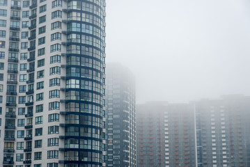 Fototapeta na wymiar multi-storey house in the fog