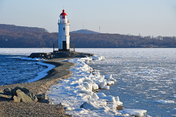 Russia. Vladivostok. The  lighthouse of Egersheld(1876 year built) Tokarevskaya koshka in winter...