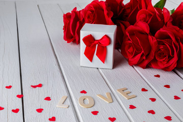 Valentines background with red rose, Heart shape, Gift box, Wooden letters word "LOVE"