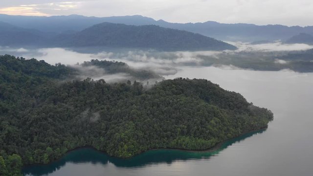 Aerial of Rainforest-covered Islands and Mist in Raja Ampat