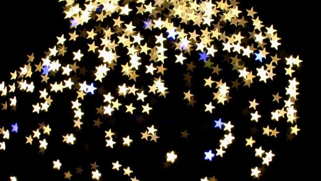 Star Shaped Bokeh Golden and Blue Blinking Lights