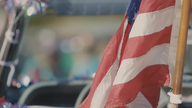 Flag blowing in the breeze in a convertible ready for a parade