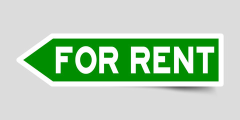 Arrow shape green color sticker in word for rent on gray background