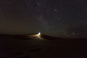 Night time landscape of the stars and sand dunes in the Sahara Desert, Merzouga, Morocco