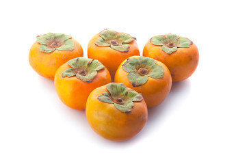 Tropical fruit persimmon. Kaki with leaves on white background.