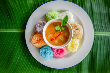 Food thai noodle vermicelli / colorful rice noodle vermicelli curry soup sauce on white plate
