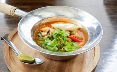 Sour soup with seafood shrimp squid Hot and sour soup fish , egg and lettuce vegetable in hot pot