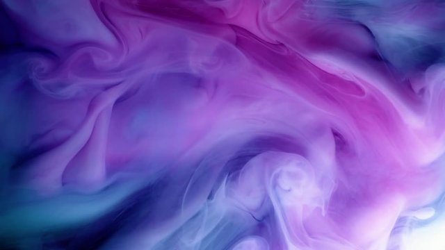 vivid colorful purple blue pink of acrylic paint drop motion texture background for abstract concept.