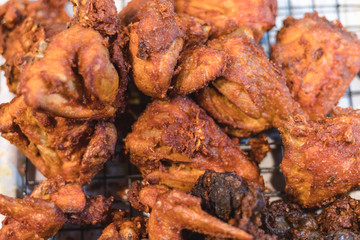 Fried chicken put all over together on tray for sell at market