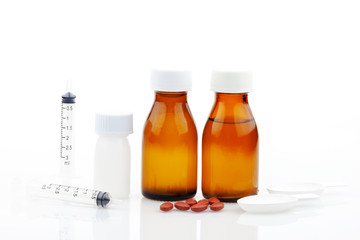 bottle of medicine,Medical drugs tablets,capsules plastic bottle,Syringe 3 ml ,Realistic medical measuring spoon,on white background