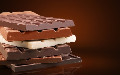 Delicious chocolates isolated on  background