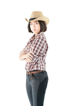 Young woman in a plaid shirt and arms crossed