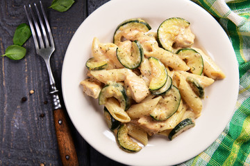 Penne pasta witch chicken and zucchini in cheese sauce