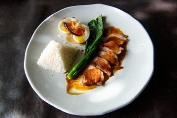 Grilled pork, boiled egg with steamed jasmine rice