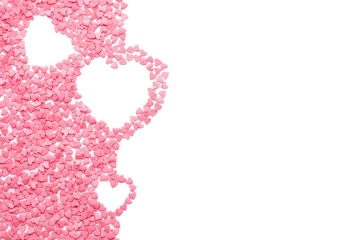 Pink candy shaped as hearts isolated on white.