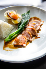 Grilled pork, boiled egg with steamed jasmine rice