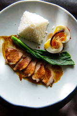 Grilled pork, boiled egg with steamed jasmine rice