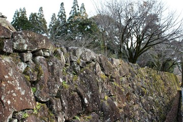 A remaining stone wall at the site of Hitoyoshi Castle in Japan