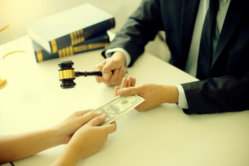 Judge lawyer gavel with bribe money in law firm