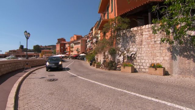 Wide Angle: Cars and Motorcycles Driving on Narrow Road