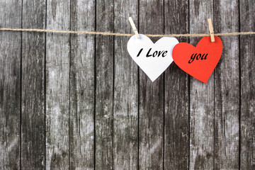 Valentine's hearts on a dark wooden background.