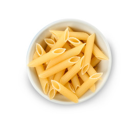 Uncooked penne pasta on white background
