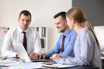 Young colleagues working together in modern office