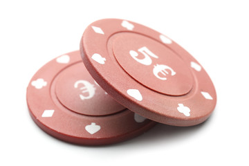 Chips for gambling games in casino on white background